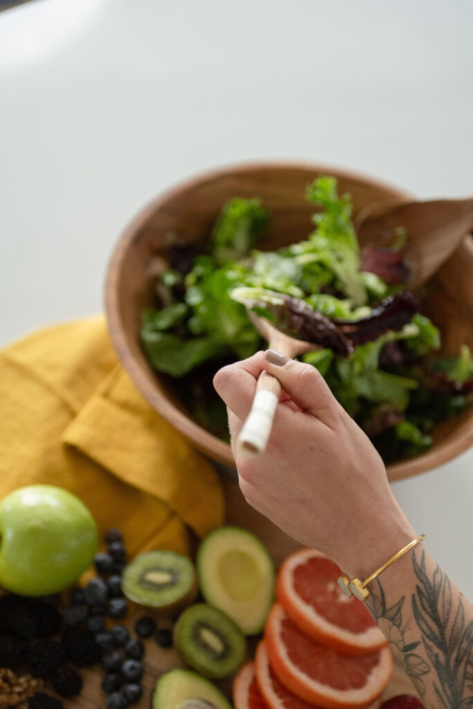 Closeup of a leafy green salad at a branding photography session